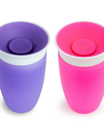Purple and pink cups with lids on a white background