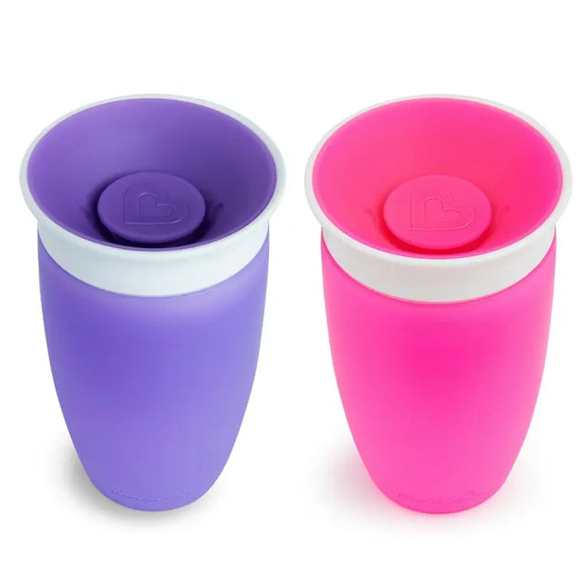Purple and pink cups with lids on a white background