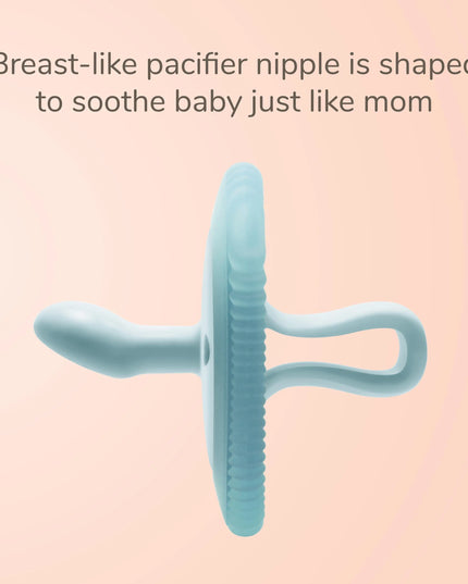 Blue pacifier nipple on a pink background with text about its design.