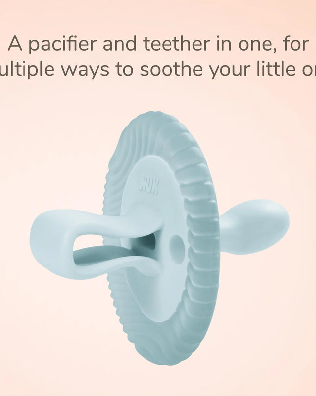 Teal silicone pacifier and teether on a light pink background with text.