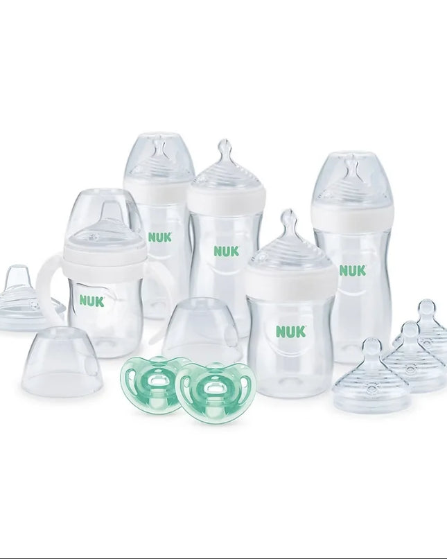 NUK baby bottles and pacifier set on a white background
