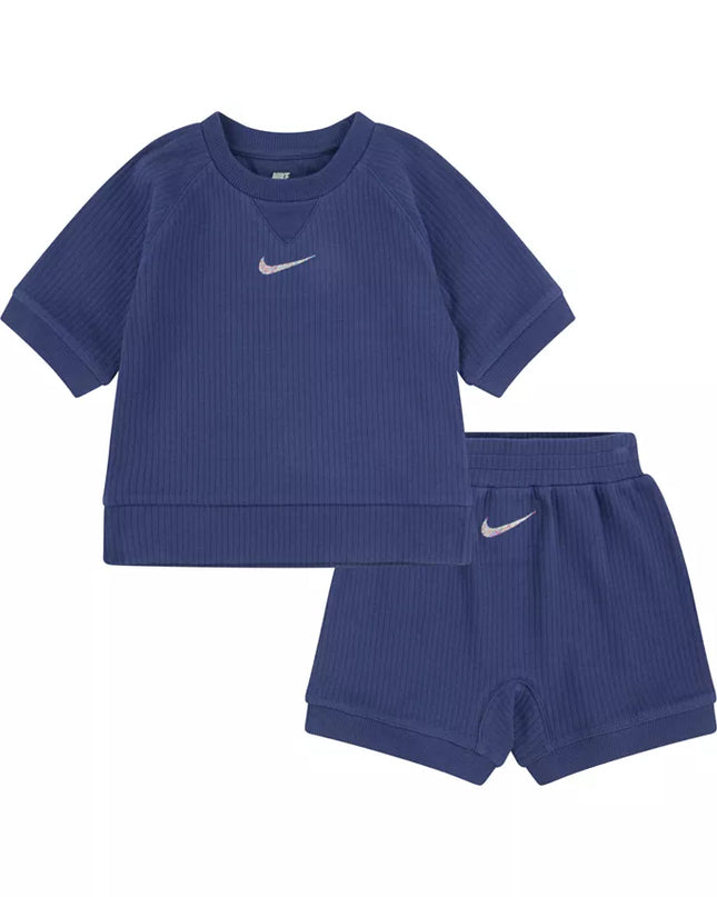 Blue ribbed sweatshirt and shorts set with Nike logo on a white background