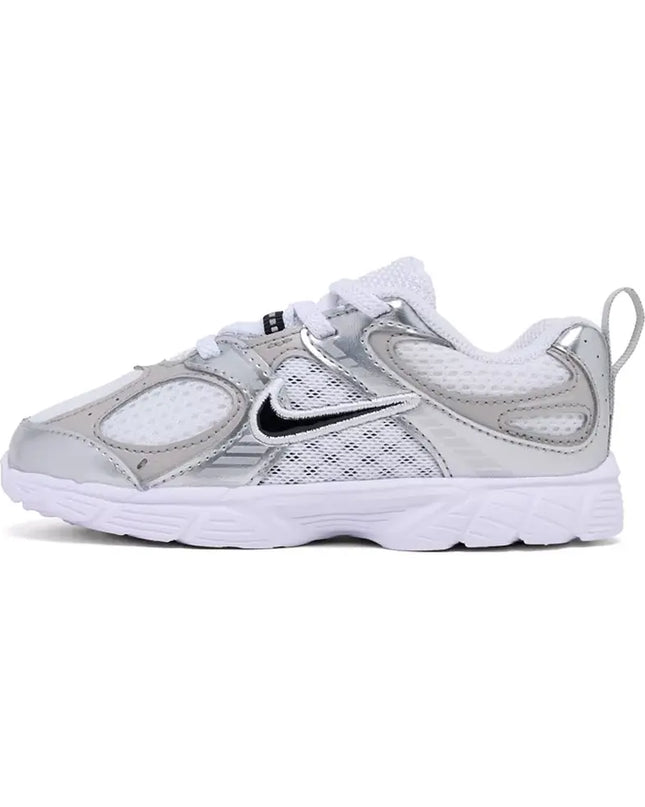 Silver and white sneaker with Nike logo on a white background