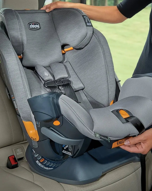 Gray and blue car seat with orange accents being adjusted inside a vehicle.