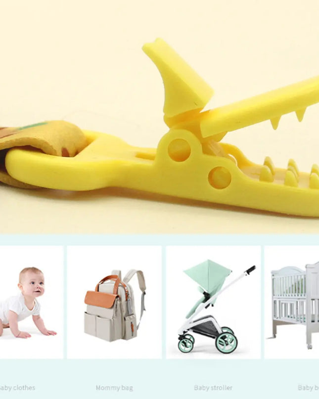Yellow alligator toy with a baby,妈咪包,婴儿车, and婴儿床的图片