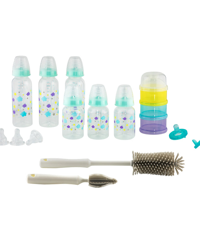 Collection of baby bottles, nipples, and cleaning tools on a white background