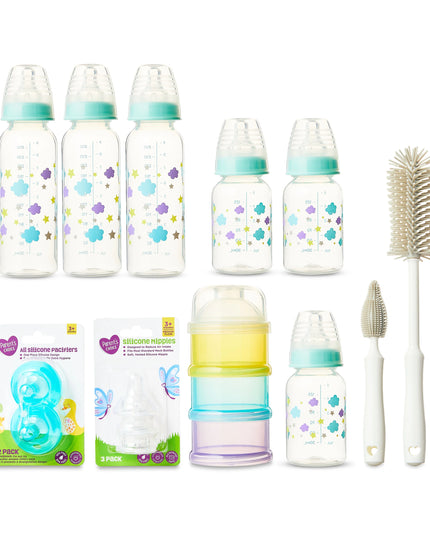 Baby bottle set with accessories on a white background