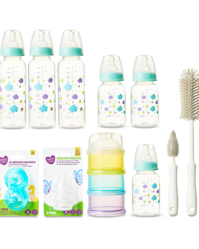 Baby bottle set with accessories on a white background