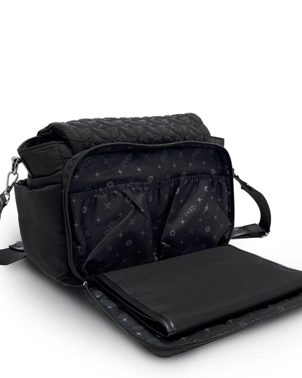Black quilted diaper bag with a changing pad on a white background