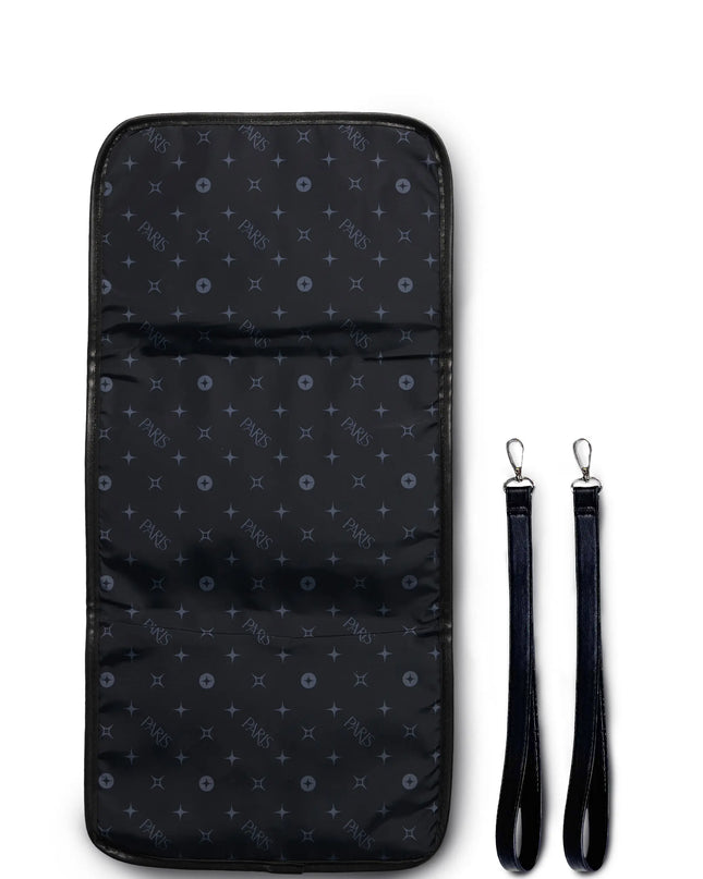 Black pouch with pattern and detachable strap on a white background