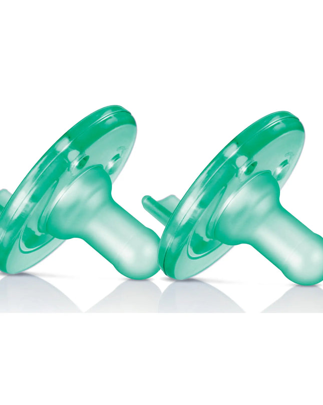 Two green plastic dumbbells on a white background