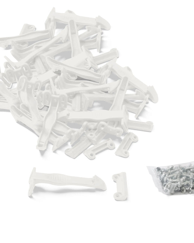 White plastic clips on a white background with a small bag of additional items.