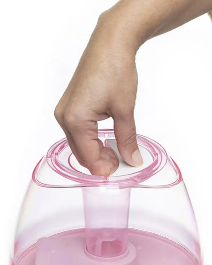 Hand opening a pink container with a white lid on a white background