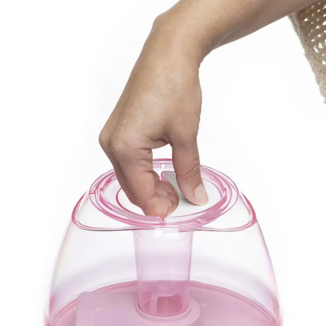 Hand opening a pink container with a white lid on a white background