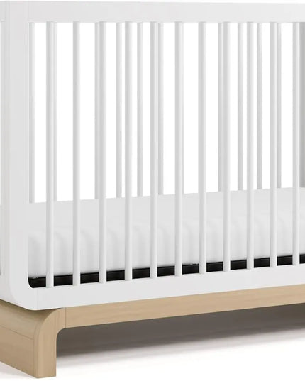 White crib with a wooden base on a white background