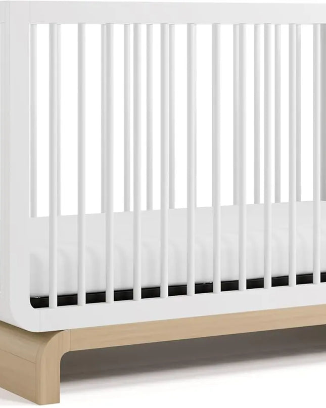 White crib with a wooden base on a white background
