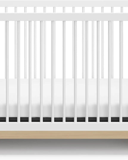 White crib with a wooden base on a white background