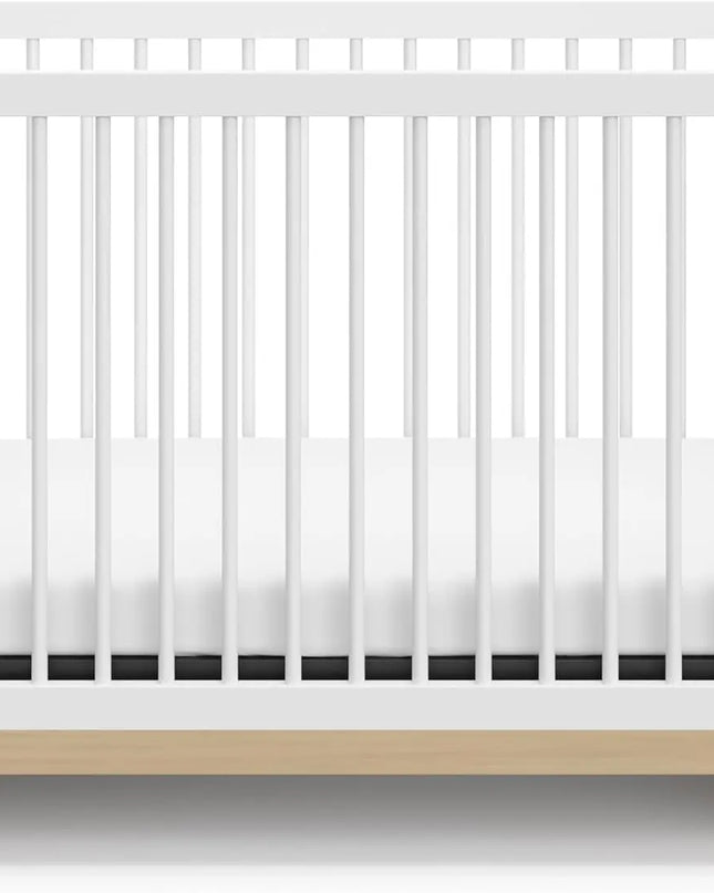 White crib with a wooden base on a white background