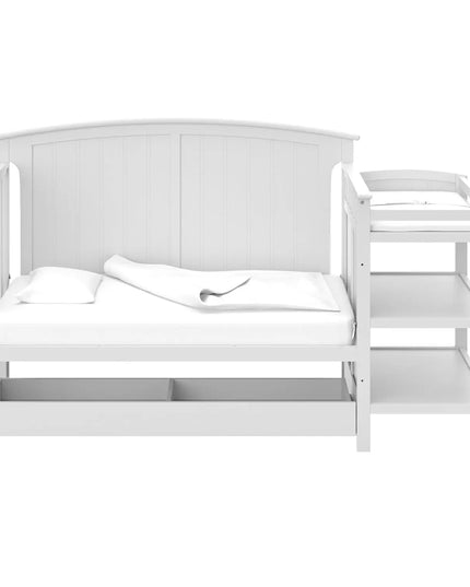 White crib with changing table on a white background