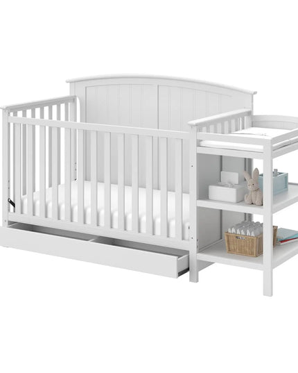 White crib with changing table on a white background
