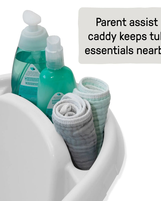 Parent assist caddy with bath products and towels inside a bathtub.