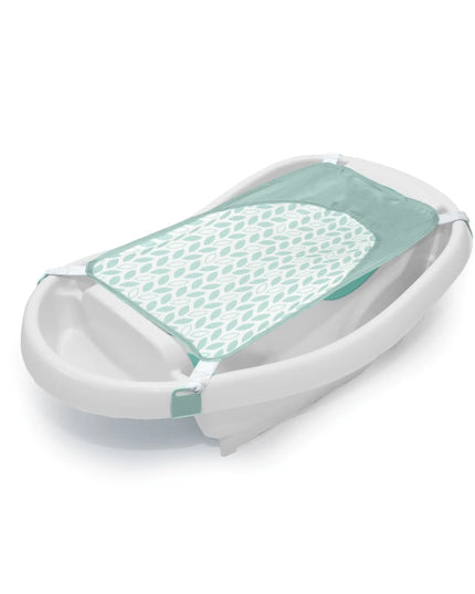 Baby bathtub with green mesh cover on a white background