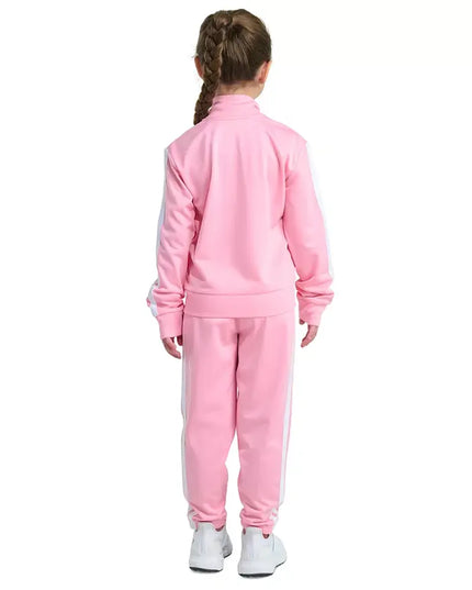 Child wearing a pink tracksuit on a white background