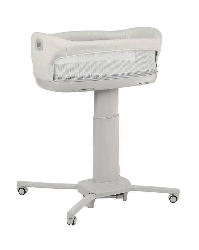 White baby bassinet with wheels on a white background