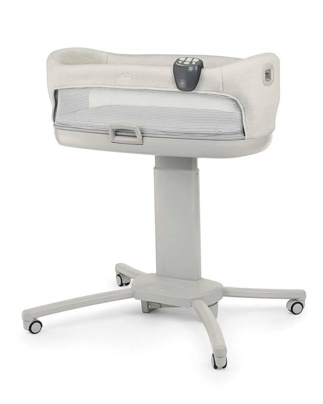 White baby bassinet with wheels on a white background