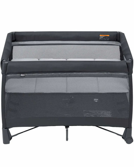 Black and gray travel cot on a white background