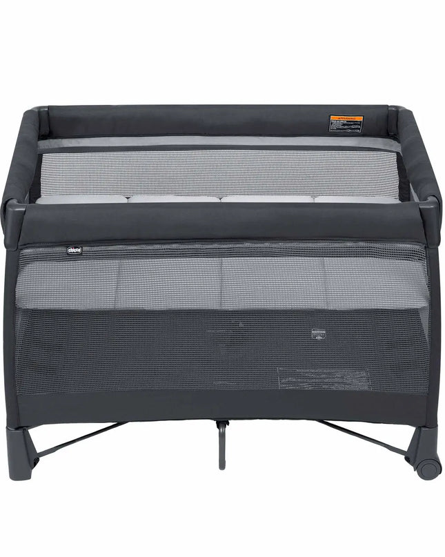 Black and gray travel cot on a white background