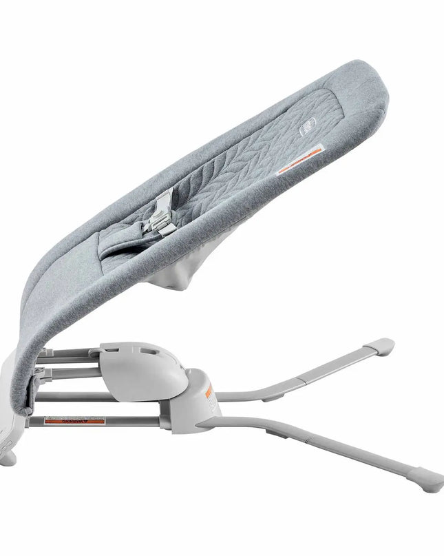Gray baby bouncer with white base on a white background
