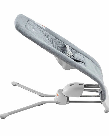 Gray baby bouncer with adjustable legs on a white background