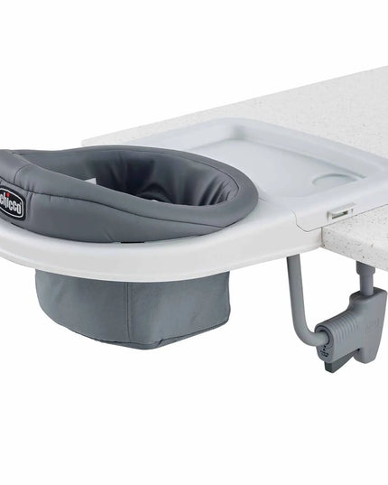 Gray baby seat attachment on a white surface