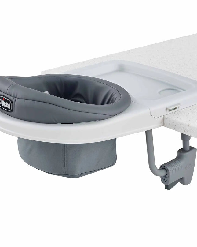 Gray baby seat attachment on a white surface