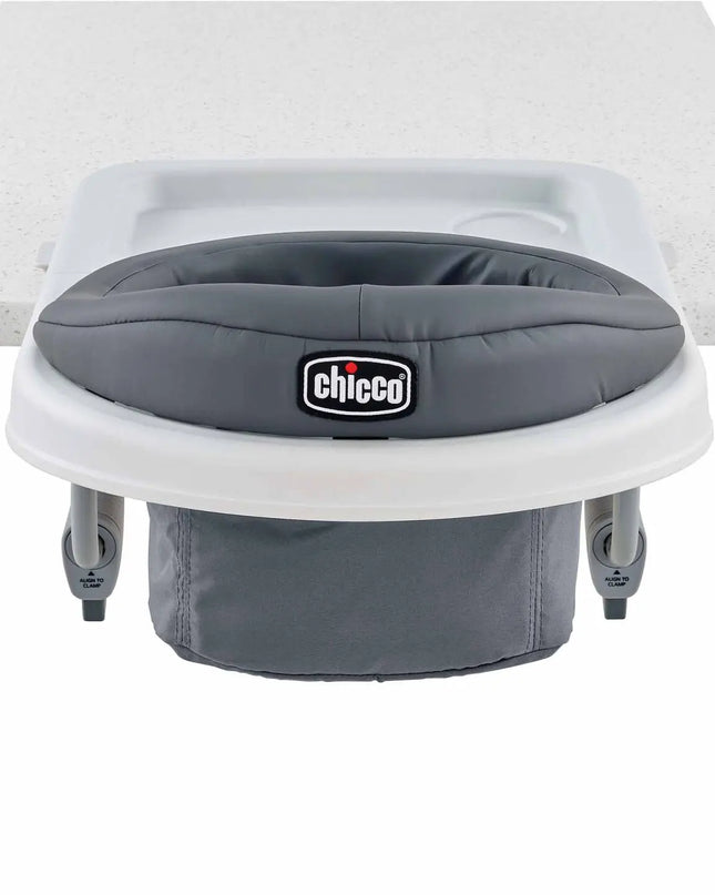 Gray baby seat with white base on a white background, featuring the Chicco brand.