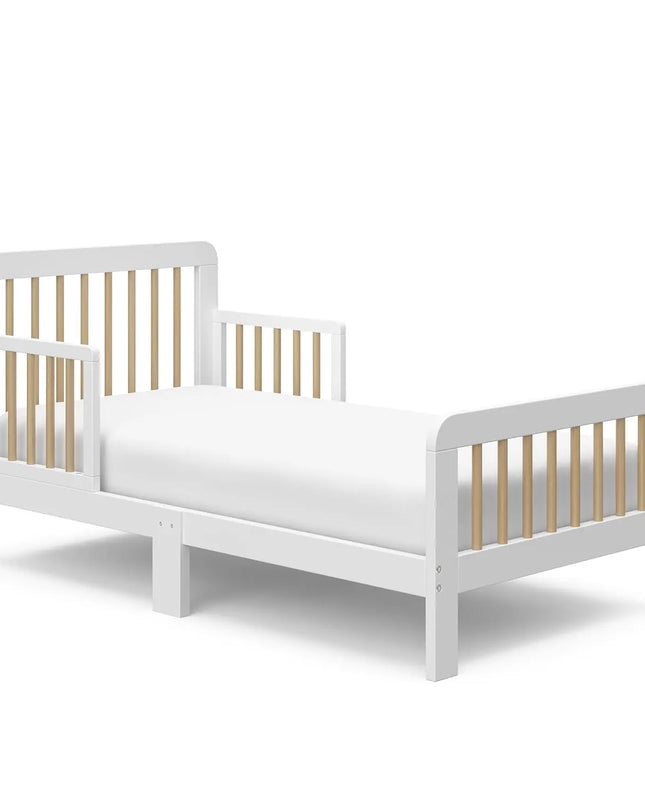 White children's bed with wooden slats on a white background